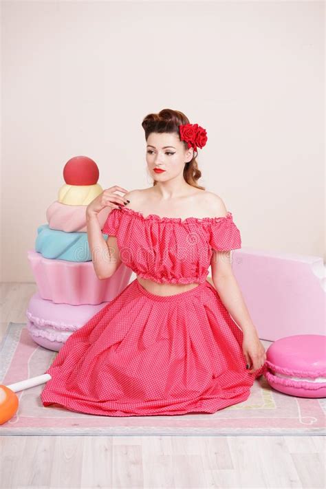 Beautiful Elegant Pin Up Woman Wearing Red Polka Dot Dress Posing With Giant Sweets Alone Stock