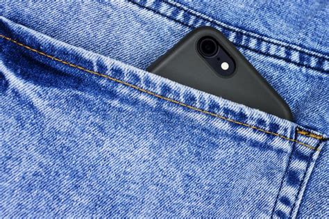 Smart Phone In The Back Pocket Of Blue Jeans Stock Image Image Of