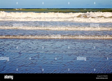 Waves Breaking On The Shore On The North Norfolk Coast At East Runton