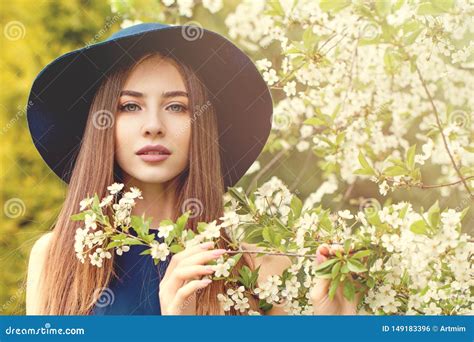 Beautiful Woman In Blue Hat Outdoors Spring Portrait Stock Photo