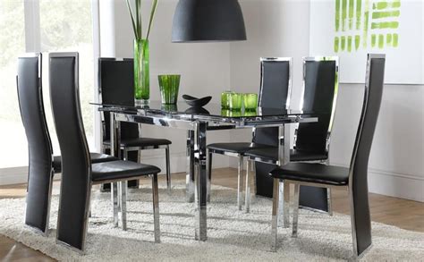This table is so tiny that you could not seat small to average size adults directly across from one another without bumping your knees against each other. Glass and Chrome Dining Tables and Chairs | Dining Room Ideas