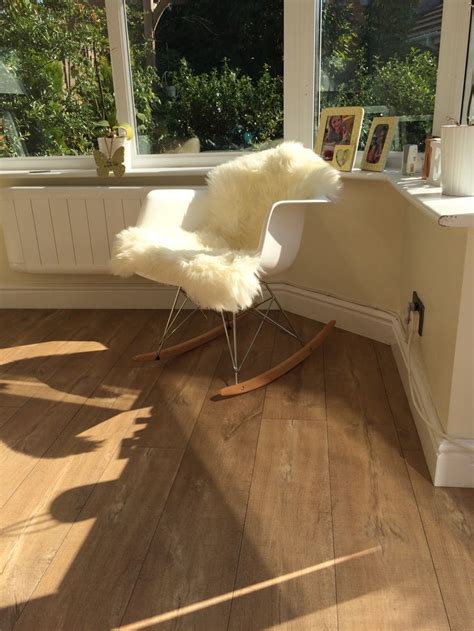 Eames rocking chair comprises a casing reinforced polypropylene fiberglass, however, its base eiffel tower is created curved birch wood and the seat is attached by legs chrome steel. Eames rocking chair with sheepskin rug | Eames rocking ...