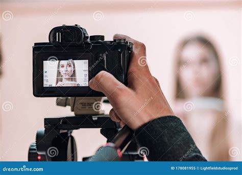 Focus Of Videographer Working With Attractive Model In Photo Studio