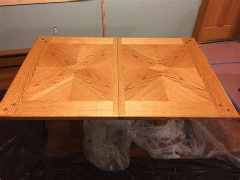 Keep the sander moving to avoid sanding through the veneer. Refinishing oak veneer table... Citristrip? Harsher chem ...