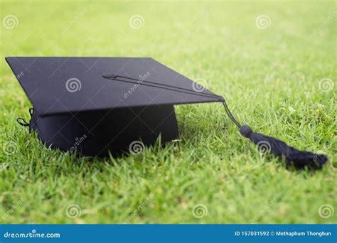 Shot Of Graduation Hats On The Grass Concept During Commencement