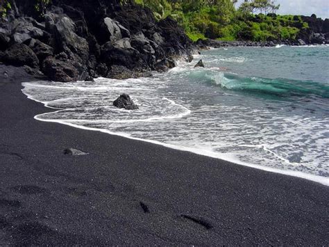 Beach is dirty and smells. 12 Most Beautiful Black Sand Beaches in the World