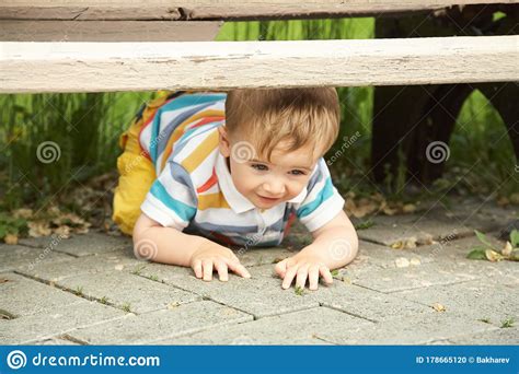 Little Boy Outdoors Funny Child Walking In The Summer Park Stock