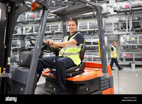 Forklift truck driver in engineering warehouse Stock Photo: 62411111