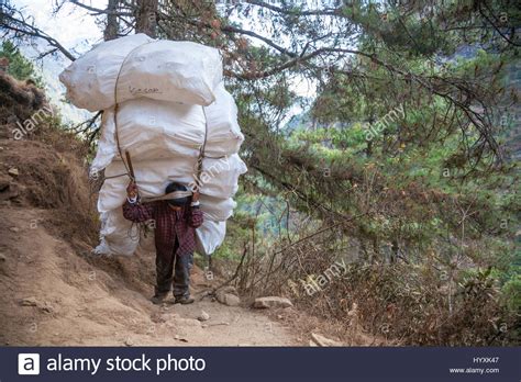 Man Carrying Load Stock Photos And Man Carrying Load Stock Images Alamy