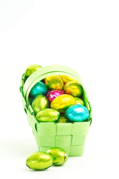 Premium Photo Foil Wrapped Easter Eggs In A Basket