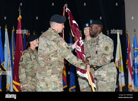 Brigadier General R Scott Dingle Hands The Flag To In Coming Colonel