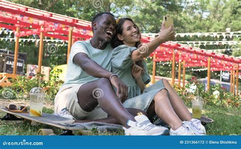 Black Man And Brunette Woman Make Selfie Drinking Lemonade Stock