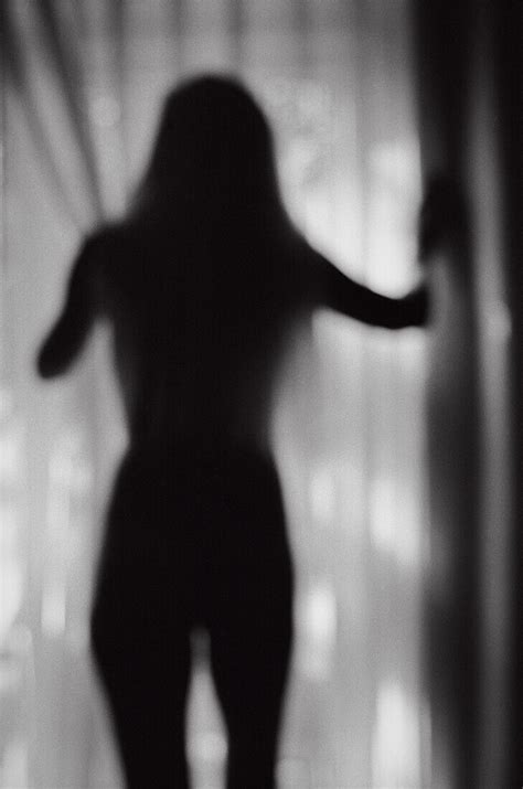 Silhouette Of Nude Woman Standing Near Bild Kaufen 71028141