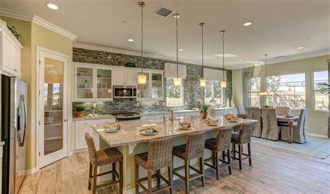 It is sometimes so surprising at how little changes can. Open kitchen with large island and corner pantry, next to ...