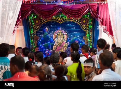 Worshipping Hindus Hindu Shrine With An Image Of The Deity Saman In