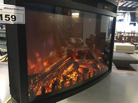 Shiny glass front panel and crystal glass bed make for a beautiful decorative piece which is also a functional heater. CURVED FRONT FREE STANDING ELECTRIC FIREPLACE (APPROX 27"W ...