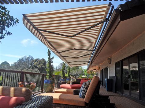 A retractable solair awning and a pergola with retractable canopies on tracks. Elite Heavy Duty Retractable Patio Awning