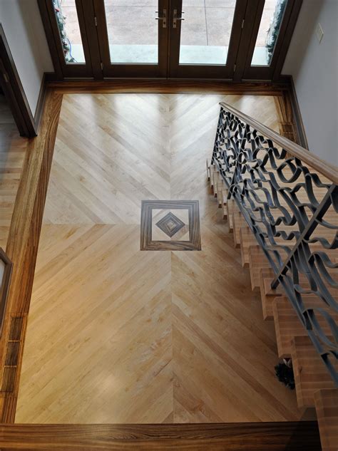 We combine ancient marquetry with modern shading techniques to create unique 3d our floor / wall art inlay collection features wood and an alluring medley of mixed media combination designs. Foyer with Maple plank floor with zebra wood inlay ...