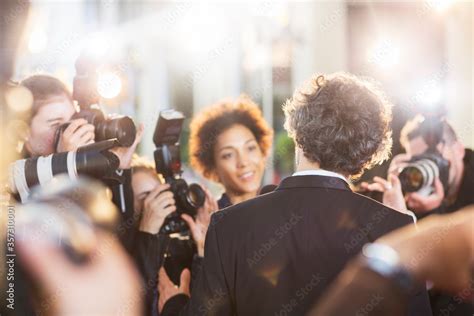 Celebrity Being Interviewed And Photographed By Paparazzi At Event