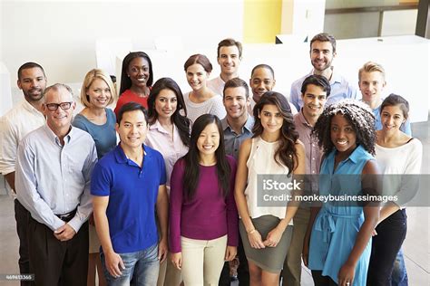 Portrait Of Multicultural Office Staff Standing In Lobby Stock Photo