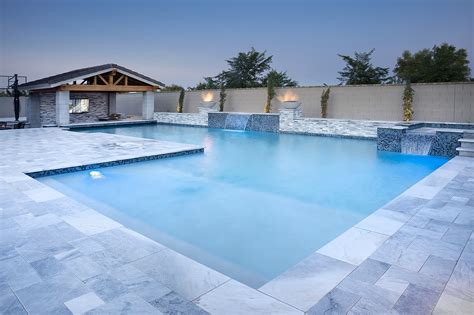 Swim Up Bar Pool With Modern Marble Pavers Unitypoolsaz Pool House