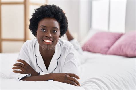 Young African American Woman Smiling Confident Lying On Bed At Bedroom Stock Image Image Of