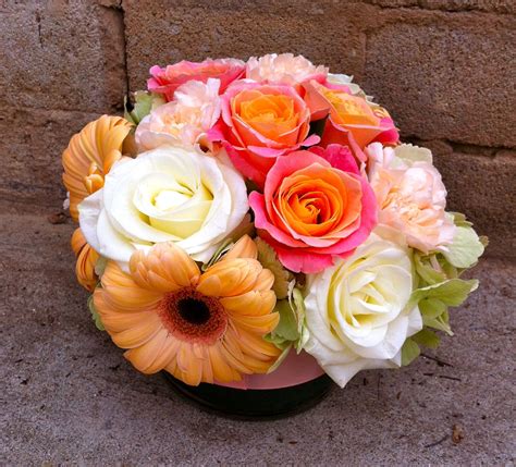Wed / december 1, 2010. Low centerpiece with peach gerber daisies, soft pink ...