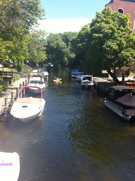 Find the top 15 cities, towns, and suburbs near traverse city, mi, like cadillac and big rapids, and explore the surrounding area for a day trip. The canals, downtown Traverse City, MI. | Traverse city ...