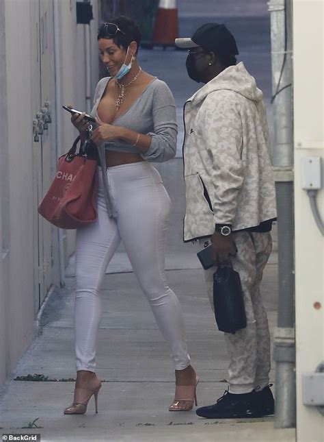 Nicole Murphy Displays Her Ample Cleavage In A Plunging Grey Crop Top