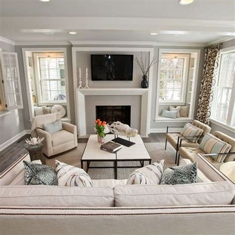 A Living Room Filled With Furniture And A Flat Screen Tv Mounted On The