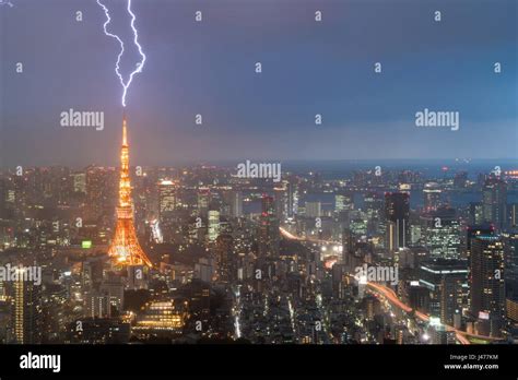 Lightning Storm Over Tokyo City Japan In Night With Thunderbolt Over