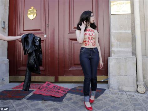 feminist protesters strip off outside embassy in support of three activists on trial in tunisia