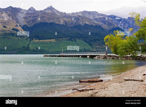 Pier On Lake Wakatipu At Glenorchy And The Mountains Behind The Lake