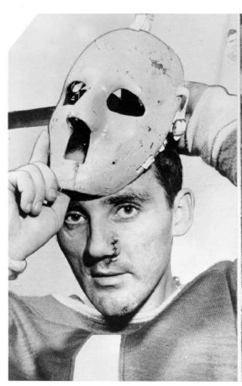 A Battered Jacques Plante Puts On His Famous Goalie Mask Which He