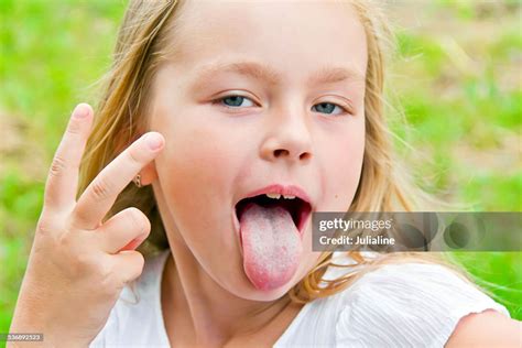 Cute Girl With Put Out Tongue High Res Stock Photo Getty Images