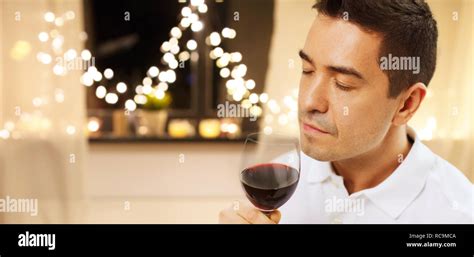 Happy Man Drinking Red Wine At Home On Christmas Stock Photo Alamy