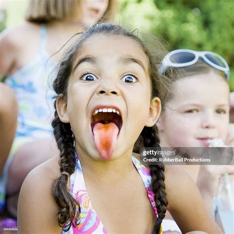 Little Girl Sticking Out Her Tongue High Res Stock Photo Getty Images