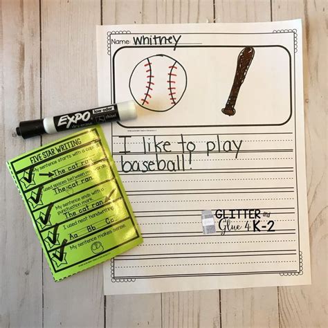 A Baseball Themed Writing Paper With Markers And Glue On It Next To A