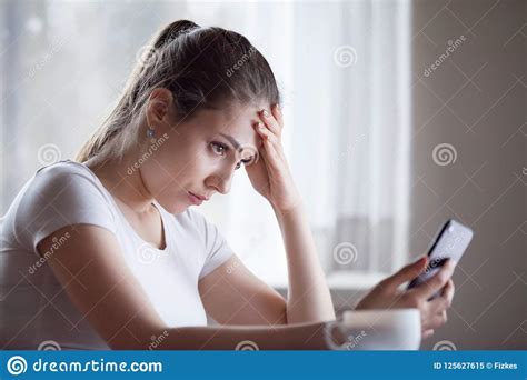Upset Young Woman Disappointed Getting Bad Message On Smartphone Stock Image Image Of Holding