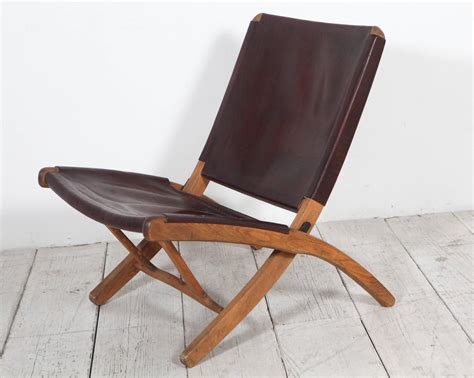Folding chair bamboo lacquered with structure in solid mahogany wood in black lacquered finish. Italian Leather and Wood Folding Chair | From a unique ...