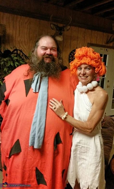 A Man And Woman Dressed Up In Costumes