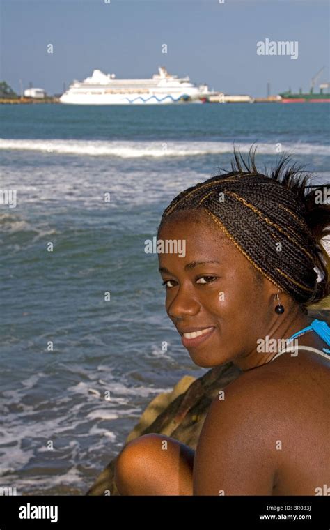 Costa Rican Afro Caribbean Woman On The Beach With The Aidaaura Cruise Ship Docked In The