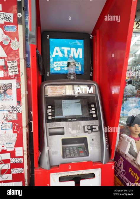 New York Usa July Image Of A Red Atm Machine In The Streets Of Manhattan Stock Photo