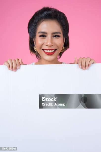 Portrait Of Fashion Woman Displaying White Banner Stock Photo