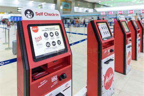 Anda harus 'check in' untuk mendapat pas masuk. Air Asia Self Check-in Service Counter Editorial ...