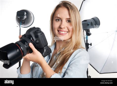 Female Professional Photographer Working In Studio Stock Photo Alamy
