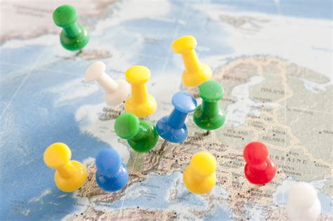 Free Image Of Colorful Pins Inserted Into Map Of Europe Freebie