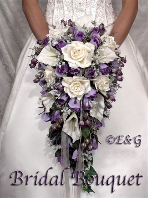 5 purple dendrobium orchids 5 lavender hyacinths 10 blue anemones 4 gray berzelia berries 10 black feather plumes a touch of purple wax flower a special thanks to sara gray photography for the beautiful. bridal bouquet package silk flowers cascade bridesmaid