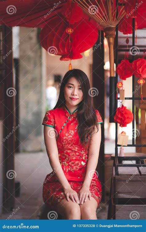 Cute Smiling Asian Chinese Woman Wearing Cheongsam Traditional Red Dress In Chinese New Year
