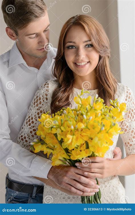 Romantic Moment Portrait Of Beautiful Young Couple Standing While